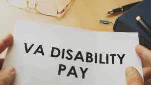 veterans disability pay document being held by a veteran with PTSD