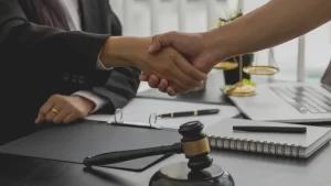Social Security Disability Appeals lawyer in New York shaking the hand of a happy client